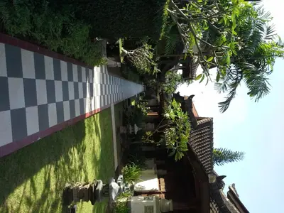 a building with plants on the side of it at Ananda Resort Seminyak in Seminyak
