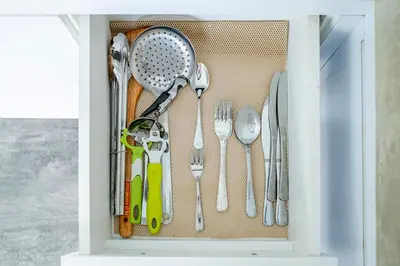 a drawer filled with utensils in a kitchen at Casa Nisa Seminyak in Seminyak