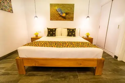 a bedroom with a king sized bed in a room at Casa Ku Seminyak in Seminyak