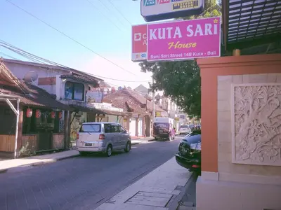a street with a sign that reads ubita sant house at Kuta Sari House in Kuta
