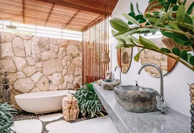 a bathroom with a bath tub and a sink at Beyond Bespoke Villas in Seminyak