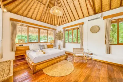 a bedroom with a bed in a room with windows at Villa Barcelona - Private 6 BDR Brand New Villa in Seminyak, Best Location, large Pool & Garden in Seminyak