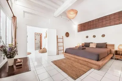a bedroom with a large bed in a white room at Villa London - Private 4 BDR Villa in Seminyak, Pool & Garden in prime Location in Seminyak