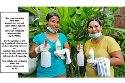 two women wearing masks and gloves holding bottles of bleach at Villa London - Private 4 BDR Villa in Seminyak, Pool & Garden in prime Location in Seminyak