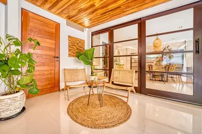 a living room with a table and chairs at Villa Aurora - Private 6 BDR Villa in Seminyak, prime Location, Pool & Garden in Seminyak