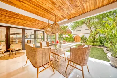 an open living room with a table and chairs at Villa Aurora - Private 6 BDR Villa in Seminyak, prime Location, Pool & Garden in Seminyak