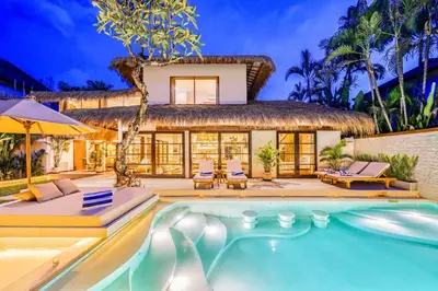 a villa with a swimming pool and a resort at Villa Aurora - Private 6 BDR Villa in Seminyak, prime Location, Pool & Garden in Seminyak