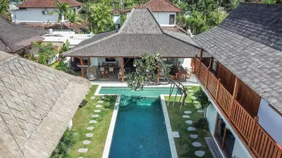 an aerial view of a house with a swimming pool at Villa KIU by Alfred in Bali in Seminyak