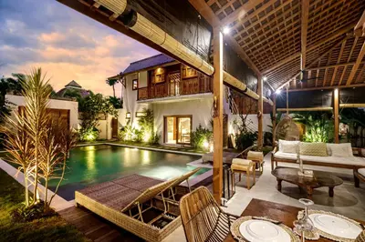 a villa with a swimming pool and a house at Villa Nabi by Alfred in Bali in Seminyak