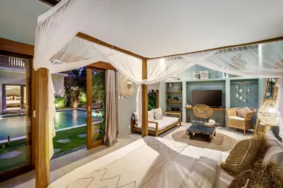 a living room with a bed and a pool at Villa Nabi by Alfred in Bali in Seminyak