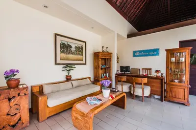 a living room with a couch and a table at Aldeoz Grand Kancana Villas Resort Bali in Kerobokan
