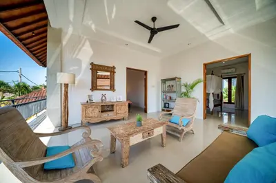 a living room with a table and chairs at Villa Devina - Seminyak in Seminyak