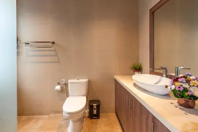 a bathroom with a toilet and a sink at La Terra Villas Canggu Kuta Bali in Canggu