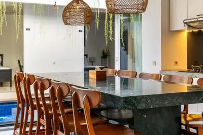 a dining room with a large table and chairs at La Terra Villas Canggu Kuta Bali in Canggu