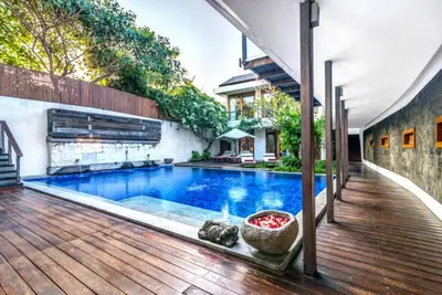 a swimming pool in the middle of a house at Villa De Jiwa 495 Seminyak in Seminyak