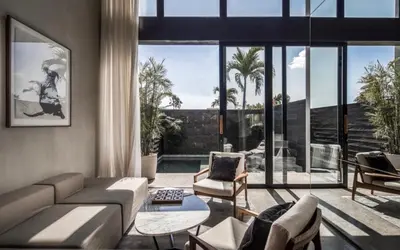 a living room with a couch and chairs at OXO Townhouses Umalas - Close to Seminyak & Canggu in Seminyak