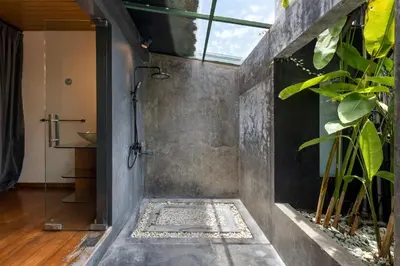 a shower in a bathroom with a plant at Saga Villas ULTRA in Seminyak