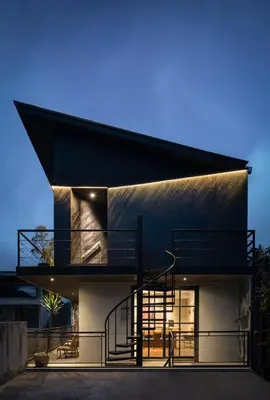 a modern house with a black roof at T Lofts in Seminyak