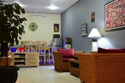 a living room with chairs and a table at Villa Eden Seminyak in Seminyak