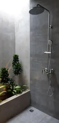 a shower in a bathroom with two potted plants at Villa Teejay - architect-designed luxury in perfect Petitenget location in Seminyak