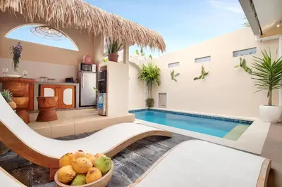 a villa with a swimming pool and a resort at Seminyak Beach Bungalow Studio Villa 1 with private pool SBB1 in Seminyak