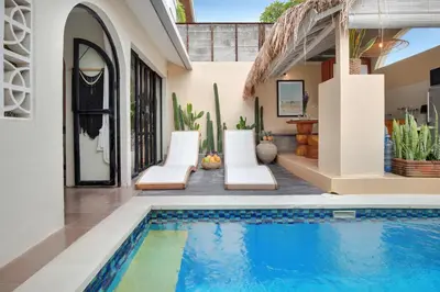 a swimming pool in the backyard of a house at Seminyak Beach Bungalow Studio Villa 1 with private pool SBB1 in Seminyak