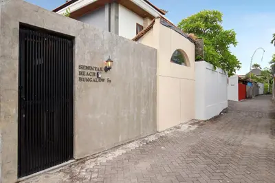 a building with a gate on the side of a street at Seminyak Beach Bungalow Studio Villa 1 with private pool SBB1 in Seminyak