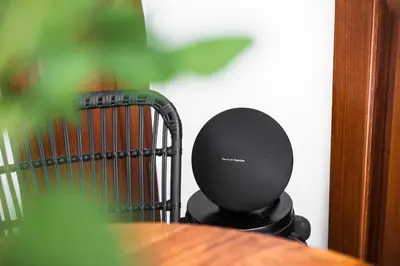 a black speaker sitting on top of a table at Villa Revo in Seminyak
