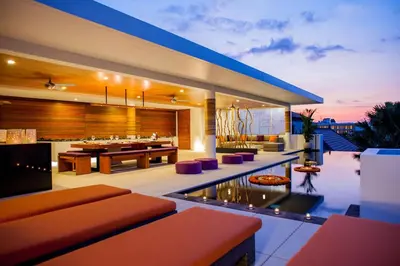 a modern house with a pool and a living room at Villa Muse Seminyak - 500 meters from beach in Seminyak