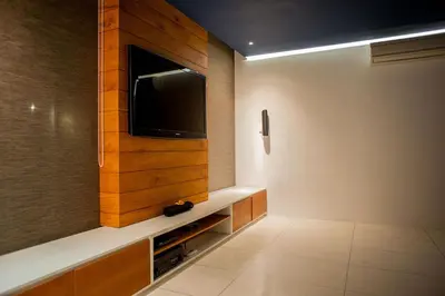 a room with a flat screen tv on a wall at Villa Muse Seminyak - 500 meters from beach in Seminyak