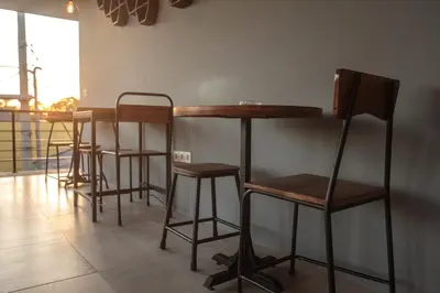 a row of bar stools in a room at 7Rooms Villa Seminyak in Seminyak