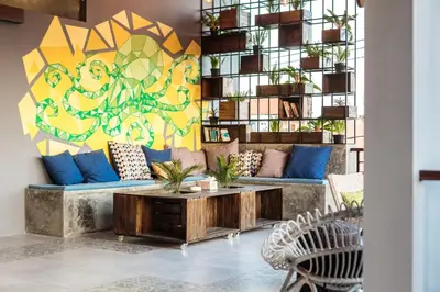a living room with a couch and a table at 7Rooms Villa Seminyak in Seminyak
