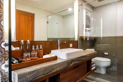 a bathroom with a sink and a toilet at Sampatti Villas in Seminyak
