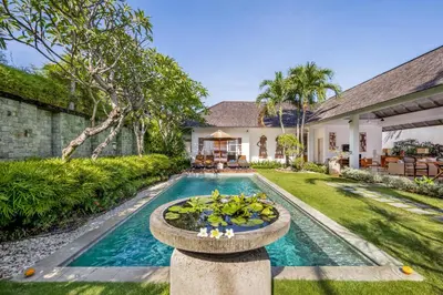 a swimming pool in the backyard of a house with a fountain at 2BR Private Villa Seminyak, Villa Kiran One in Seminyak