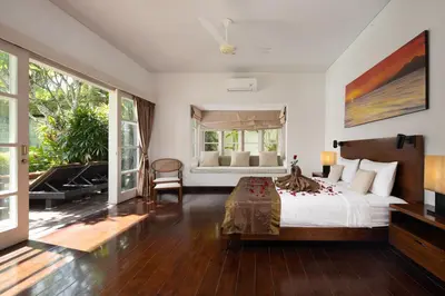 a bedroom with a bed and a large window at 2BR Private Villa Seminyak, Villa Kiran One in Seminyak