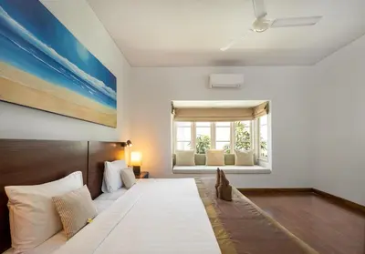 a bedroom with a large bed and a window at 2BR Private Villa Seminyak, Villa Kiran One in Seminyak