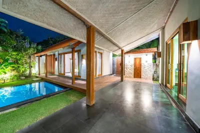 an external view of a house with a swimming pool at Villa Litera Canggu Bali in Canggu