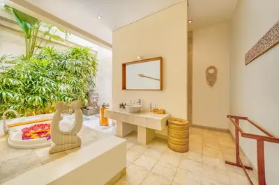 a bathroom with a sink and a bathtub and a sink at Villa Milano - Private 6 BDR Villa in Seminyak, prime Location, Pool & Garden in Canggu