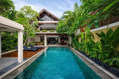 an image of a swimming pool in front of a house at Harmony Villa Dua in Seminyak