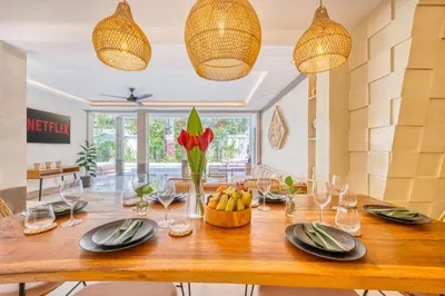 a dining room with a wooden table with a bowl of fruit at Villa Florence - 3BDR Luxury Villa, Private Pool, Walk to the Beach in Seminyak