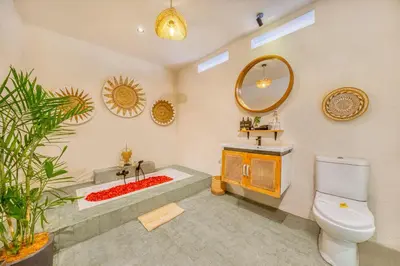 a bathroom with a toilet and a sink and a tub at Villa Florence - 3BDR Luxury Villa, Private Pool, Walk to the Beach in Seminyak