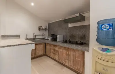 a kitchen with a sink and a counter top at Bunga 2 in Seminyak