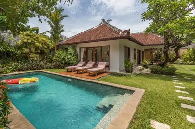a swimming pool in the yard of a house at Bunga 2 in Seminyak