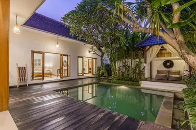 an external view of a villa with a swimming pool at Pulesari 2 bedrooms in Seminyak