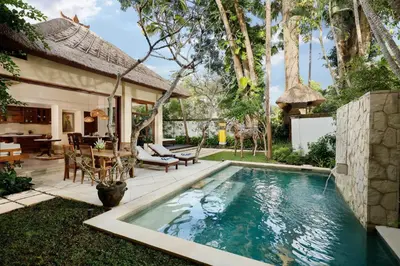 a swimming pool in the backyard of a house at Jimbaran Beach Villas by Nakula in Jimbaran