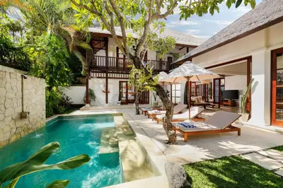 a pool in the backyard of a villa at Jimbaran Beach Villas by Nakula in Jimbaran