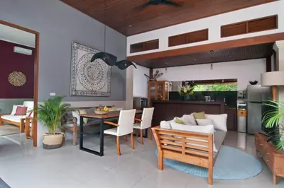 a kitchen and living room with a table and chairs at 2BR Villa Violetta - Minggu Villas - Special Stay Bonus in Kerobokan