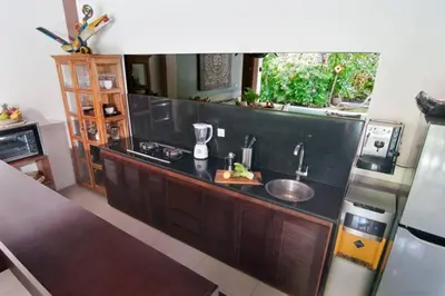 a kitchen with a sink and a counter at 2BR Villa Violetta - Minggu Villas - Special Stay Bonus in Kerobokan