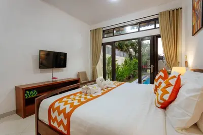 a bedroom with a large bed with a large window at Villa Penny, Seminyak - Spacious 3 Bedroom Pool Villa! in Seminyak