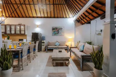 a living room with a couch and a table at Villa Penny, Seminyak - Spacious 3 Bedroom Pool Villa! in Seminyak